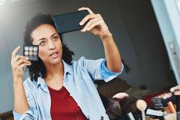 woman taking selfie talking to camera