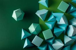 a pile of three dimensional shapes in green